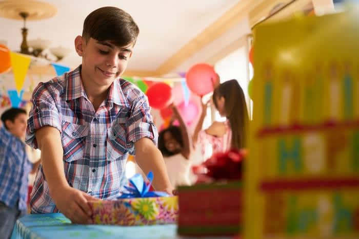 Boy wrapping with Cellotape